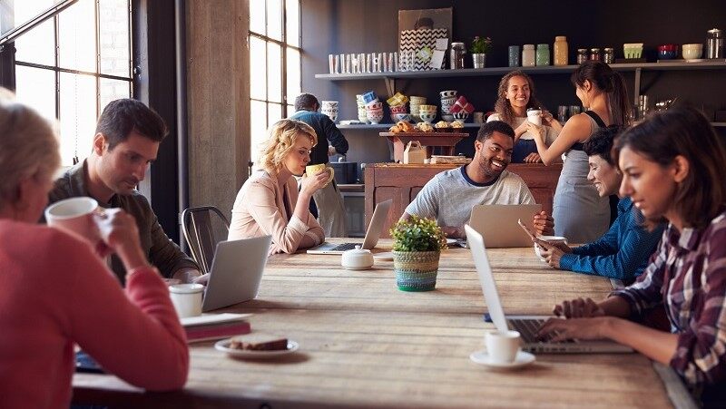 Image of people working while enjoying there coffee